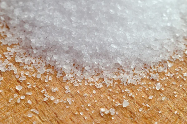 Sea ​​salt on a wooden surface — Stock Photo, Image