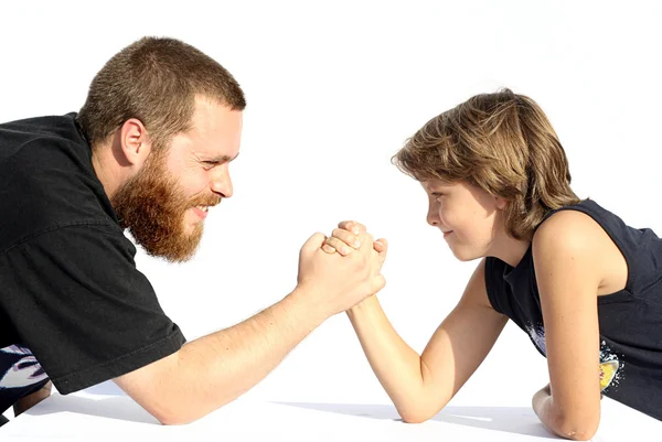 Power struggle, father and son arm wrestling — Stock Photo, Image