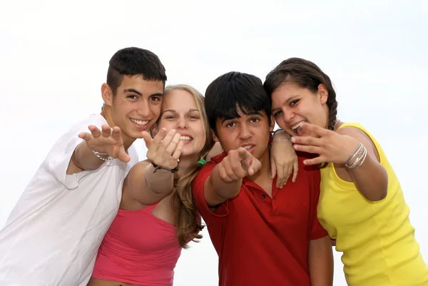 Happy group of kids pointing and beckoning Royalty Free Stock Images