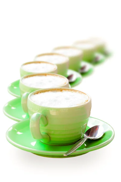 Green coffee cup placed in a row — Zdjęcie stockowe