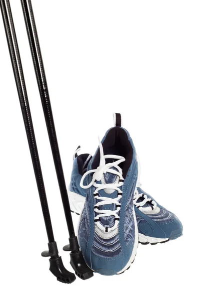 Sticks for Nordic walking and sports shoes isolated on white — Stock Photo, Image