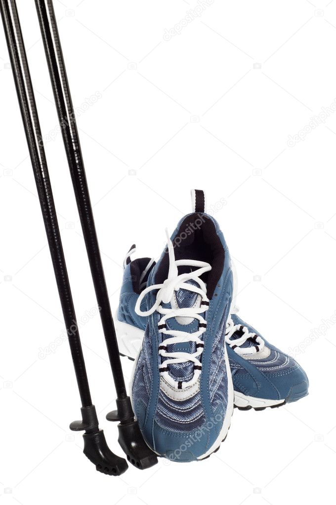 Sticks for Nordic walking and sports shoes isolated on white