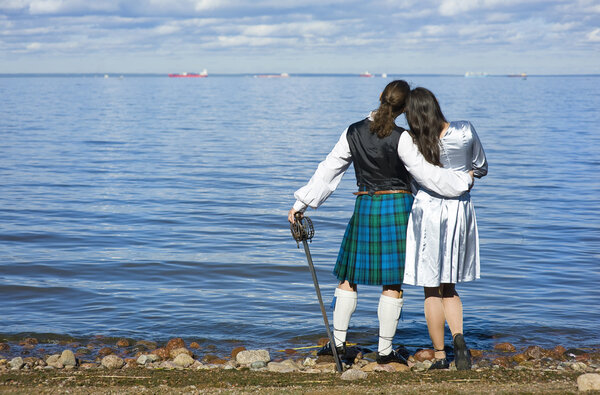 Woman and man looking at the sea
