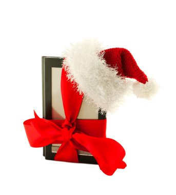 Electronic book reader wearing Santa's hat clipart