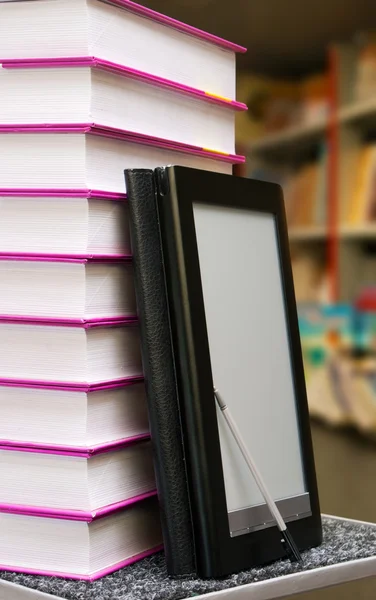 Stack of books with electronic book reader — Stock Photo, Image