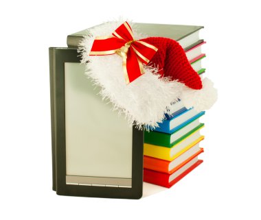 Electronic book reader wearing Santa's hat with stack of books clipart