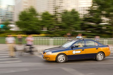 Intentional motion blur of Beijing taxi car clipart