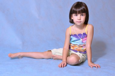 Little girl posing in studio clipart