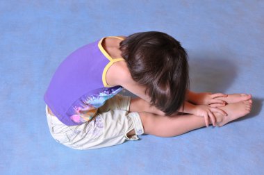 Little girl posing in studio clipart