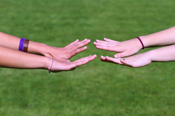 Young hands of teenage girls
