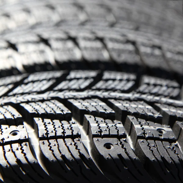 Neumáticos nuevos apilados — Foto de Stock