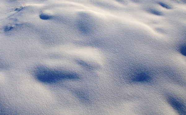 Фон из снега, сияющий солнцем — стоковое фото