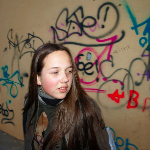 stock image Young girl on graffiti background