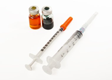 Two syringes and two bottles of medicine isolated on white background clipart