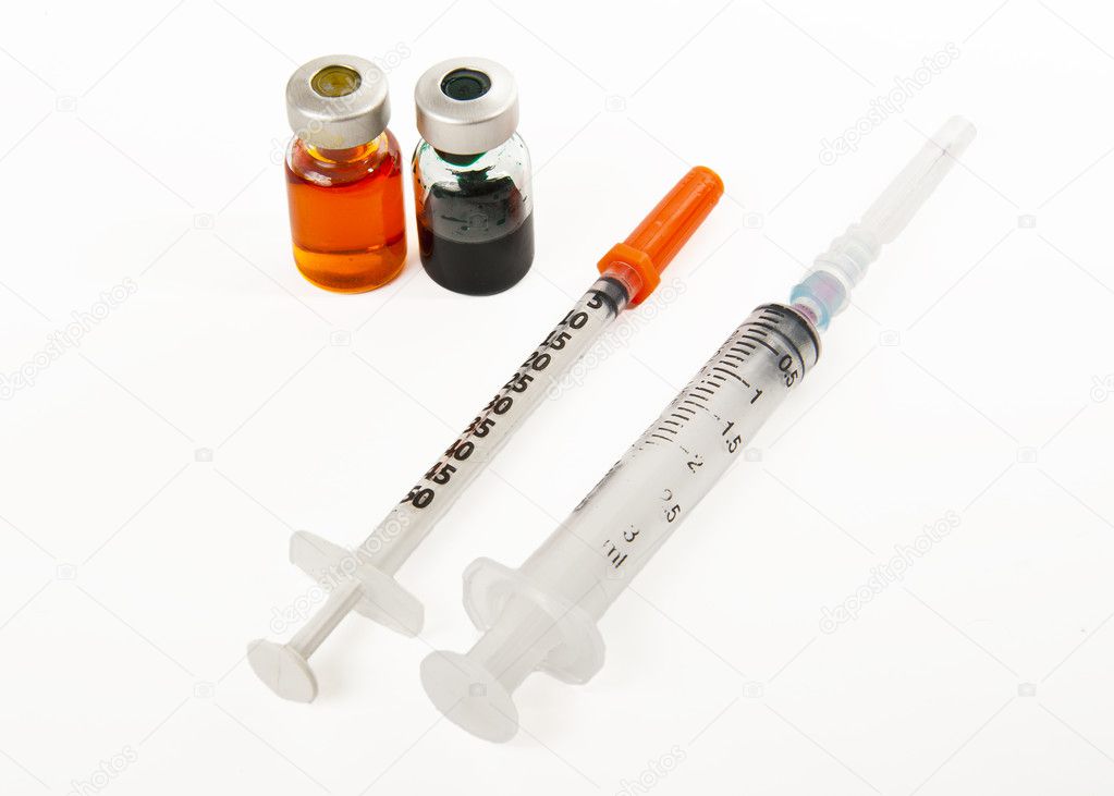 Two syringes and two bottles of medicine isolated on white background