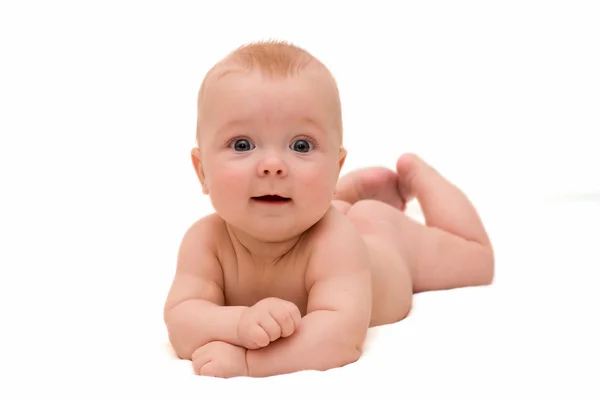 The baby lies on a white background — Stock Photo, Image