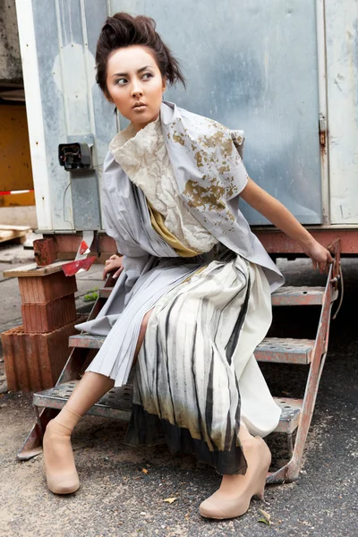 Modern fashionable woman over gray — Stock Photo, Image