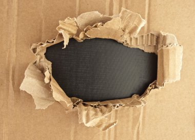 Breakthrough cardboard hole. clipart