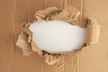 Breakthrough cardboard hole. clipart