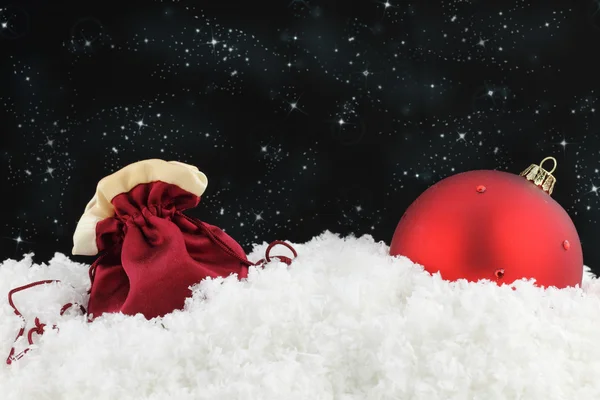 Červený míč pytel a Vánoce — Stock fotografie