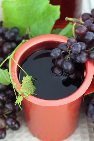 Red wine in a bronze pot — Stock Photo, Image