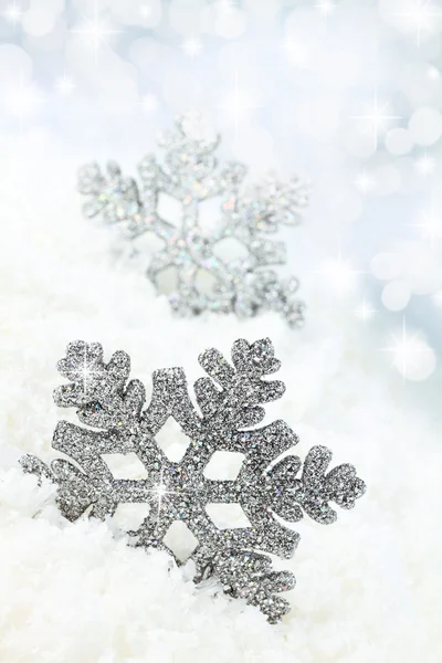 Snowflake on the snow background — Stock Photo, Image
