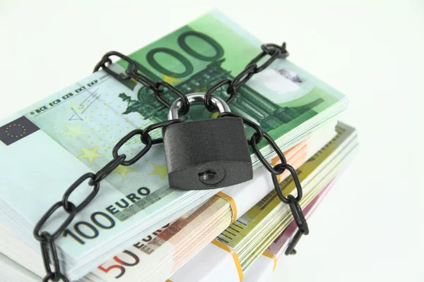 Locked money on white background — Stock Photo, Image