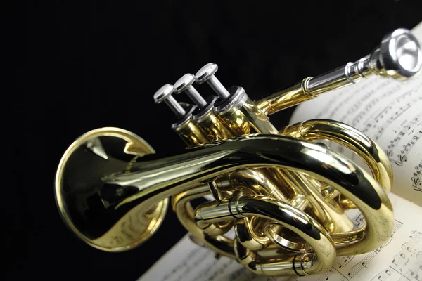 Trumpet with music sheet — Stock Photo, Image