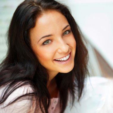 Closeup portrait of a beautiful young woman having a happy thoug clipart