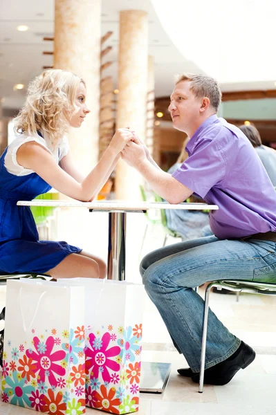 Closeup portrait of young cute couple at mall cafe. — Stock Photo, Image