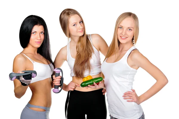 Drie mooie jonge vrouwen dragen sportkleding geïsoleerd tegen — Stockfoto
