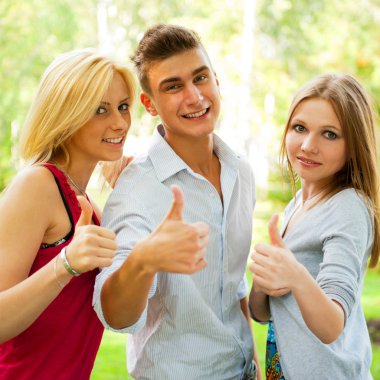 Portrait of three young teenagers laughing and having fun togeth clipart