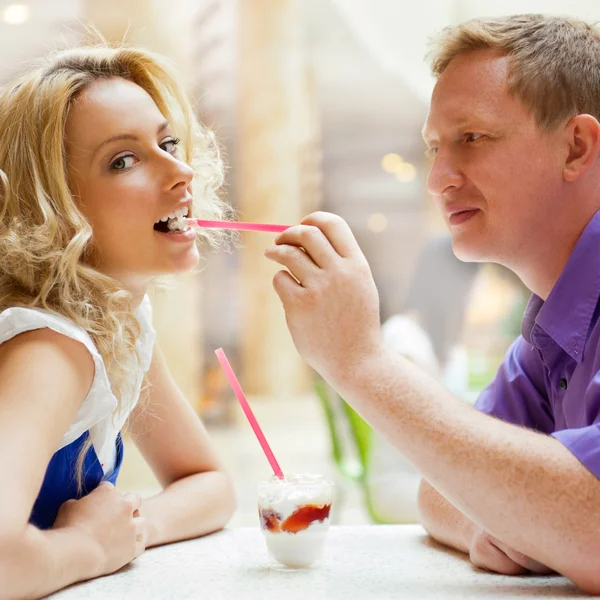 Closeup portrait of young cute couple at mall cafe. Man proposin — Stock Photo, Image
