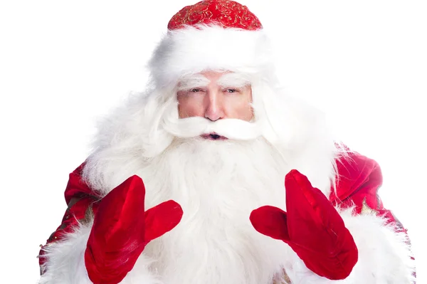 Vánoční téma: Santa Claus, uklonil se něco z jeho paží — Stock fotografie