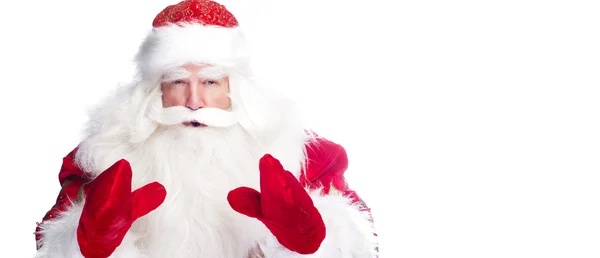 Vánoční téma: Santa Claus, uklonil se něco z jeho paží — Stock fotografie