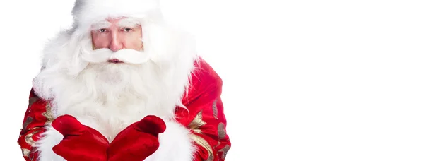Christmas theme: Santa Claus bowing something from his arms — Stock Photo, Image