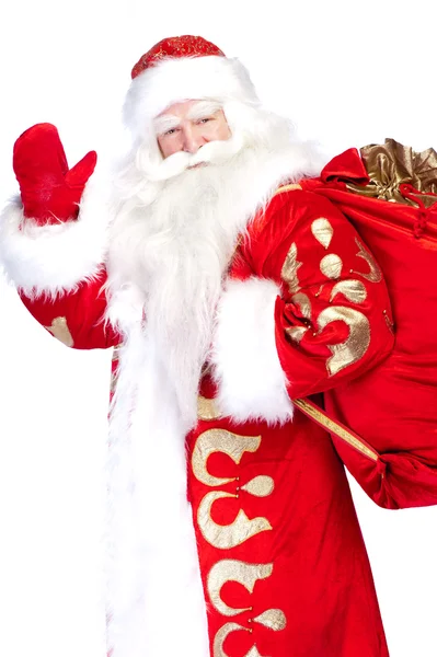 Santa claus vstávání na bílém pozadí s jeho pytel plný — Stock fotografie