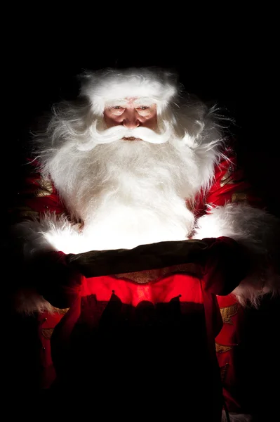 サンタ クリスマスの部屋に座っていると袋に探して — ストック写真