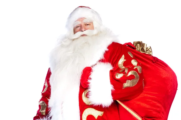 Santa claus vstávání na bílém pozadí s jeho pytel plný — Stock fotografie
