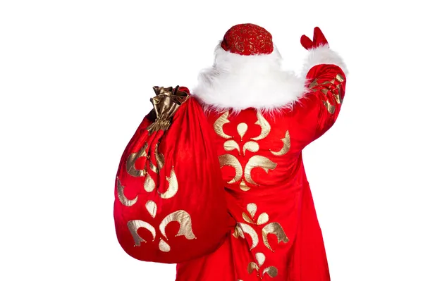 Santa claus stojącej na białym tle z jego torbą pełną — Zdjęcie stockowe