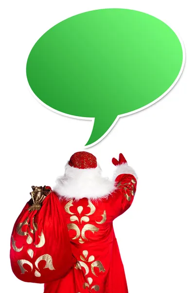 Santa Claus standing up on white background with his bag full of — Stock Photo, Image