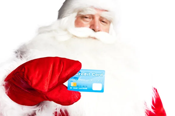 Traditional Santa Claus holding and sowing credit card while giv — Stock Photo, Image