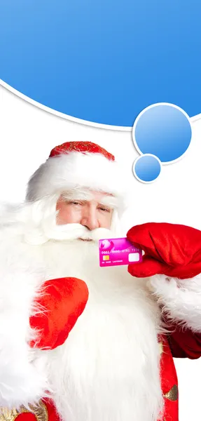 Traditional Santa Claus holding and sowing credit card while giv — Stock Photo, Image
