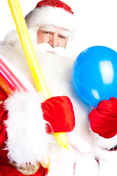Traditional Santa Claus holding balloons for children. Isolated — Stock Photo, Image