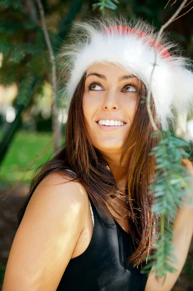 Portrait of a sexy young female smiling in a park and looking at — Stock Photo, Image
