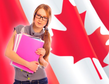 Portrait of pretty young woman holding book in her arms. Canadia clipart