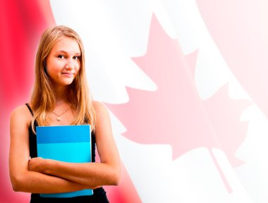 Portrait of pretty young woman holding book in her arms. Canadia clipart