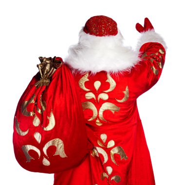 Santa Claus standing up on white background with his bag full of clipart