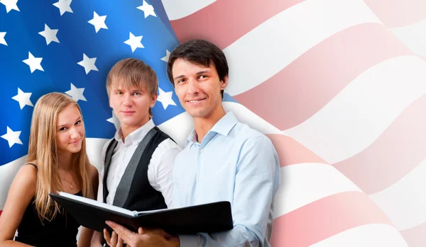Group of young students standing with their teacher against Amer — Stock Photo, Image