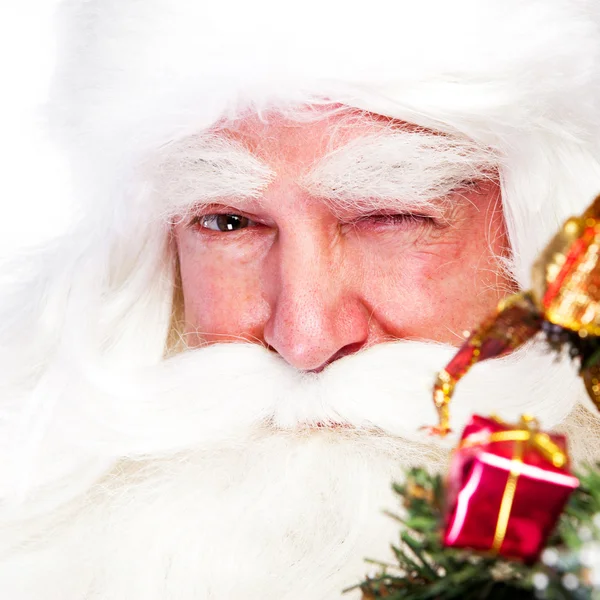 Christmas theme: Santa Claus holding christmas tree and his bag full of gif — Stock Photo, Image